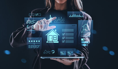 Woman using futuristic holographic interface with real estate analytics and housing data on dark background, representing smart property management concept.