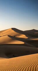 Scenic orange sunset over the Sahara Desert's vast sand dunes