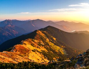 Sunrise illuminates mountain ridges with vibrant autumn colors