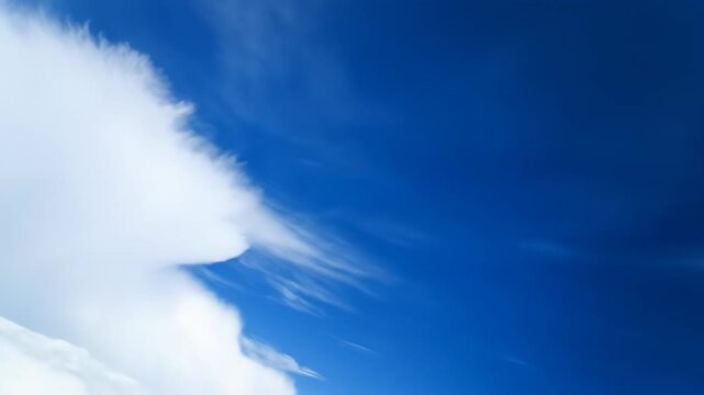 Fast-moving clouds scud across a deep blue sky in a dynamic time-lapse, showcasing rapid atmospheric change beautiful, growth, daytime
