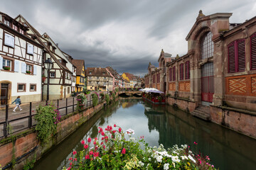 Fototapeta premium Colourful half-timbered houses at the Quai de la Poissonnerie at the river Lauch in Colmar, Alsace, France.