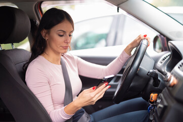 Woman texting while driving causing distracted driving risk