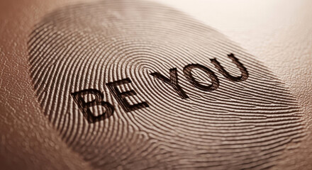 Macro Close Up Fingerprint with "BE YOU" Motivational Text Inside