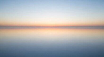 Obraz premium Serene sunset over tranquil water horizon for nature inspired wall art or home decor
