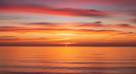 Fototapeta premium Beautiful ocean sunset with vibrant sky colors for relaxation and peaceful design