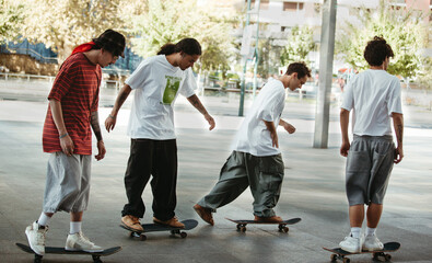 Group of young skaters riding together in an urban plaza © Raquel