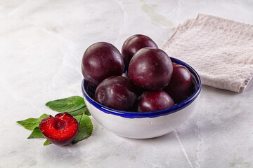 Raw ripe purple plum heap