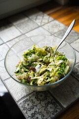 Fresh vegetable salad in glass bowl, organic greens close-up and healthy clean eating at home