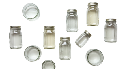 Empty glass jars with metal lids isolated on white background, several open and closed containers for storage or preservation
