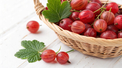Red gooseberries in basket with leaves isolated in white background 