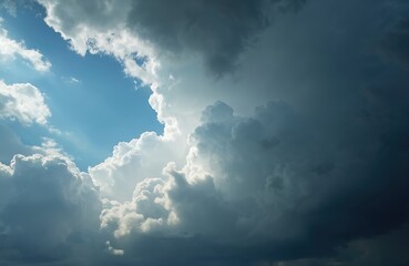 Dramatic storm clouds gather in the sky with sun rays peeking through. Dark and light clouds contrast in a dramatic cloudscape. Weather changes with stormy clouds. Cloudy blue sky with sunbeams.