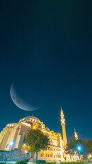 Islamic or ramadan background photo. Suleymaniye Mosque and crescent moon © senerdagasan