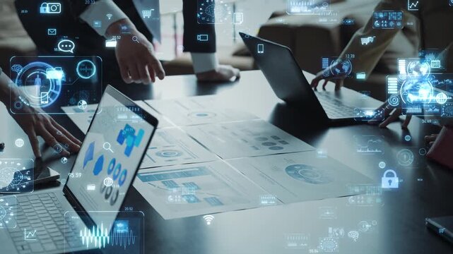 Concept image of a group of business people meeting in an office and digital technology