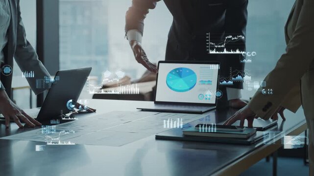 Concept image of a group of business people meeting in an office with business data