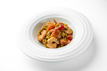 Tagliatelle pasta with shrimp, cherry tomatoes, and creamy sauce, garnished with herbs. Served in a white bowl. Close-up shot, vibrant colors, gourmet seafood dish.