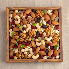 top view of nuts mix and almond on a wooden tray