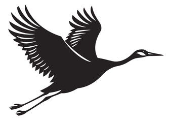 Obraz premium Silhouette of a graceful crane bird in flight with wings spread wide flying