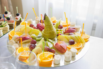 Platter with fruits on a buffet table

