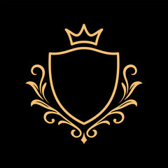 Obraz premium golden royal shield emblem with crown and ornamental floral design on black background