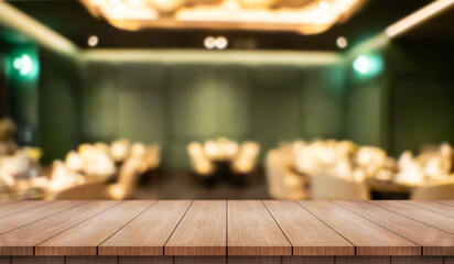 Empty wooden table top with lights bokeh on blur restaurant background.
