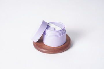 A Glad2Glow moisturizer is placed on a white background.
