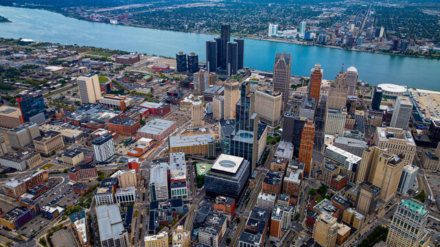 Detroit skyline aerial view with river and Windsor. Downtown Detroit skyline with Windsor, Canada visible across the Detroit River.