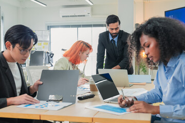 group of multicultural male and female professionals meet inside a contemporary office, leveraging artificial intelligence and big data analytics to brainstorm, exchange ideas, and build adaptive 