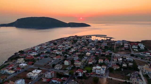 Aerial sunset view of the town of Marathopoli in Messinia, Peloponese, Greece, with the island of Proti