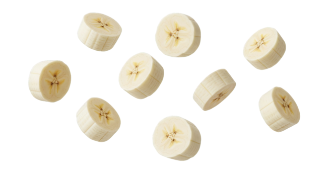Floating banana slices are isolated, creating a sense of weightlessness and fresh, healthy eating