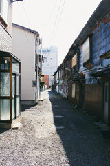 Moody and cinematic rustic back alley in a Japanese town