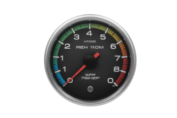 A close-up shot of an analog tachometer with a colored scale, showing engine RPM. background removed