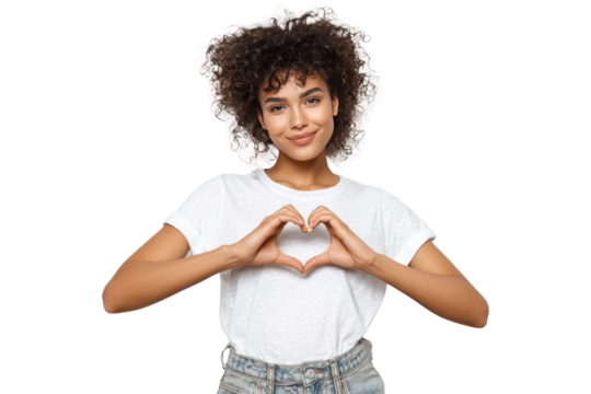 Young Woman with Curly Hair Wearing White T Shirt Making Heart Shape with Hands in Studio