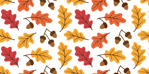 Fototapeta premium Seamless pattern of colorful oak leaves and acorns in autumn colors on a white background