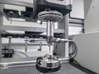 Precision measuring tool in a high-tech laboratory setting, capturing intricate details of a...