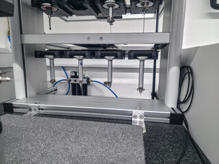 Advanced equipment in a manufacturing facility focused on precision engineering and automation processes during the day