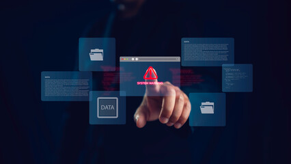 A man touches a virtual warning icon on a digital screen showing system alert and data folders,...