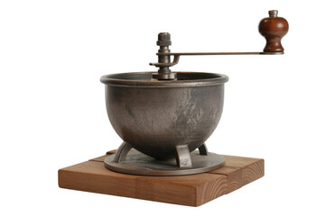 Antique manual coffee grinder with metal body and wooden handle on a wooden base. background removed
