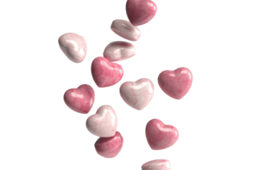 Pink and white marble heart shapes falling against a transparent background. background removed