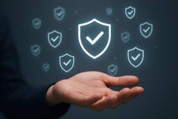 Digital security concept with glowing shields and checkmarks over a hand in a dark background
