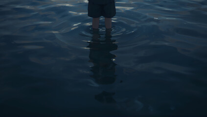 Person standing in water, reflecting on life and mental health