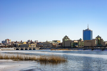 A view from the Miass River embankment in Chelyabinsk, Russia of the city's panorama, with the blue...