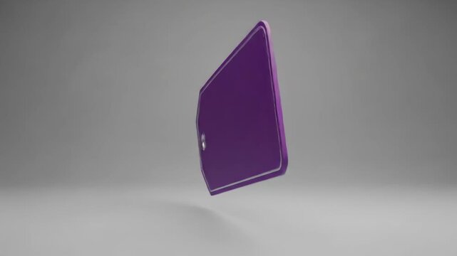 A purple price tag with a silver border is positioned at an angle, resting on a gray surface with soft lighting
