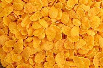 Corn flakes background texture close up. Top view cornflake cereal box for morning breakfast