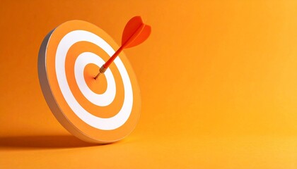Arrow hits bullseye on orange target, symbol of precision and success.