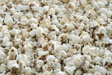 Salt Popcorn Texture Abstract Background. Big amount of pop corn close up