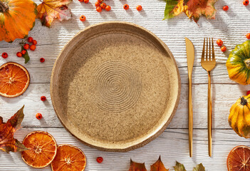 Empty plate and autumn elements