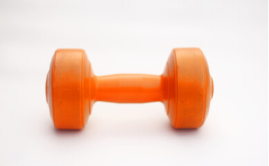 Orange dumbbells on a white background