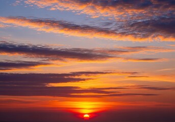 Vibrant sunset sky with glowing clouds and warm orange horizon colors