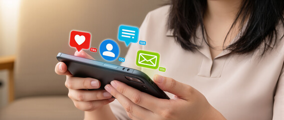 hands of woman using smart phone with notification icons of love, like, message, comment, email, address, shopping, star above smartphone screen, Social, media, Marketing concept