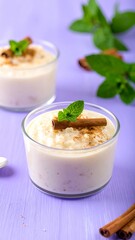 Creamy Rice Pudding Dessert with Cinnamon and Mint Garnish.